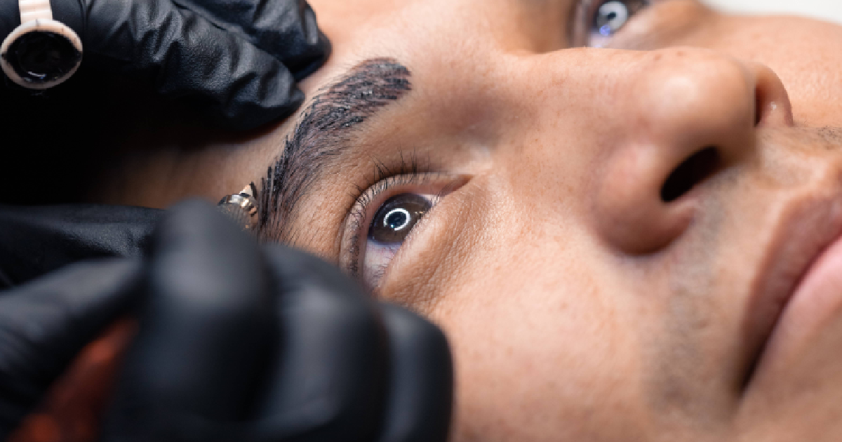 man receiving a microblading procedure on his eyebrow in Kaysville, UT