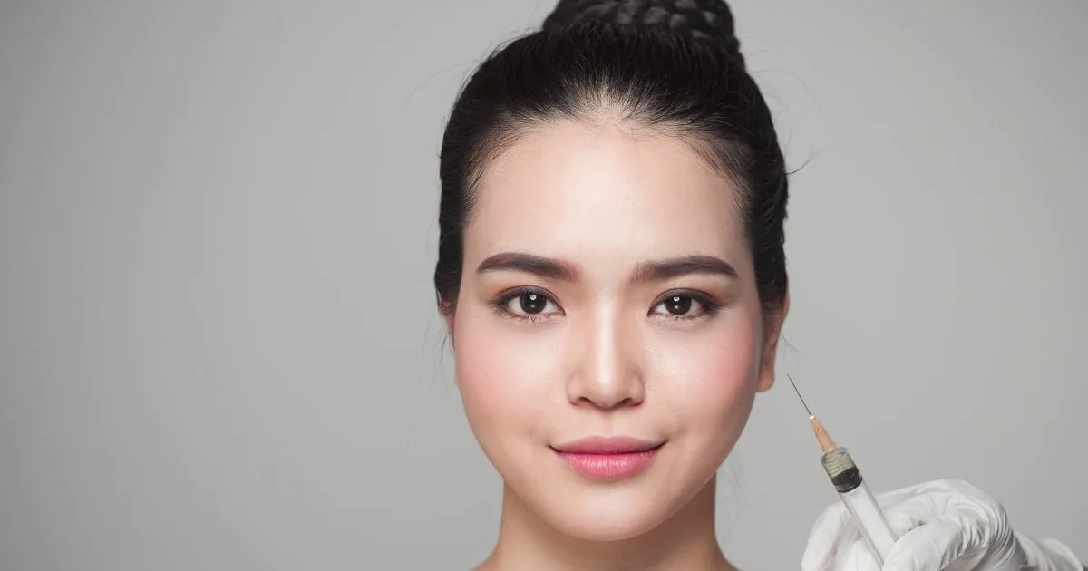 Woman with clear, youthful, and naturally radiant skin, showcasing the confidence achieved through aesthetic treatments.